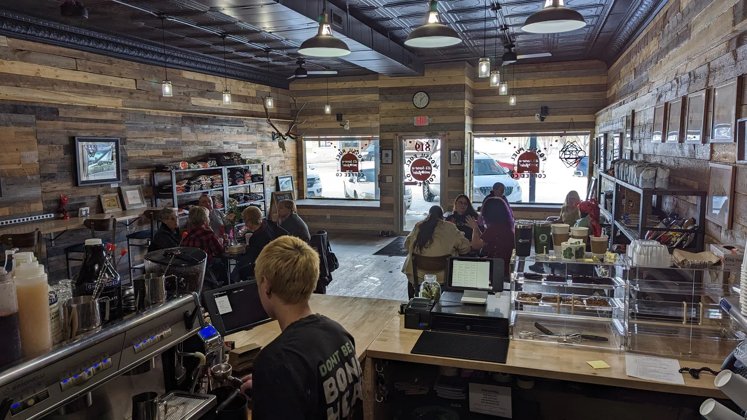 The shop floor, with merch shelves along the wall