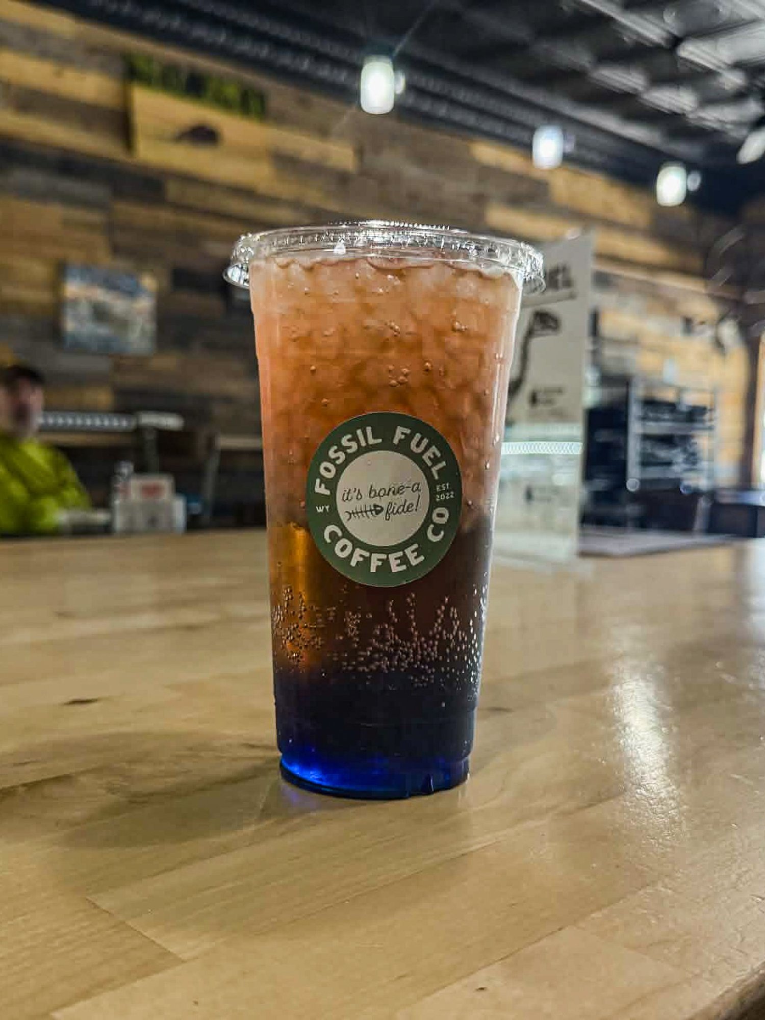 Liberty Dirty Soda in a cup with a straw