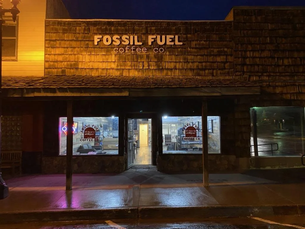 Fossil Fuel Coffee Co. neon sign at night on Main Street in Kemmerer